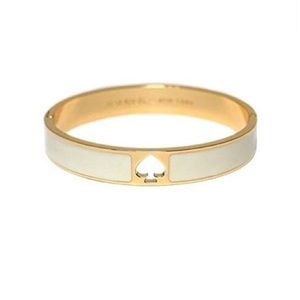 NWT Kate Spade Hole Punch Spade Hinge Bangle Cream Gold